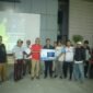 Camat Mekar Baru, Aan Ansori usai Nobar Piala AFF U19 dan bagikan doorprize. (Foto: Ifakta.co/Alex)